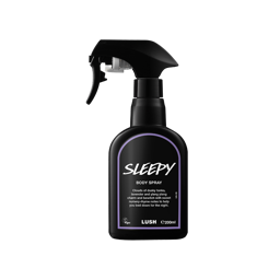 Sleepy body spray. A black spray bottle of Lush "Sleepy" Body Spray. The product label is black with a lavender purple banded border. White text states the product name and the scent description.
