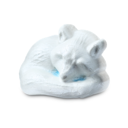 Arctic Fox. A fox-shaped bath bomb moulded into the shape of a sleeping white fox curled up with its tail tucked around its body, featuring a hint of light blue colour visible underneath.