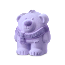 Snoozy Bear. A bear-shaped bath bomb with a pale lavender-coloured body, featuring a sculpted face, a round purple nose, and small fur details. The bear wears a ribbed, knitted scarf in a darker purple shade.