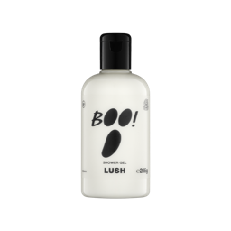 A clear bottle filled with opaque white Lush Boo! shower gel, topped with a black cap and featuring a white label with bold black text that resembles a ghost's face