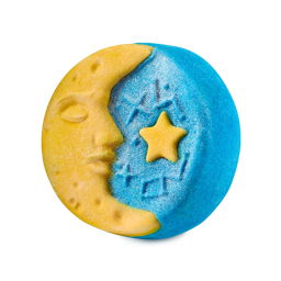 Christmas Eve. A round, disc-shaped bubble bar featuring a yellow crescent moon with a sleeping face profile beside a shimmering blue night sky embossed with a yellow five-pointed star,