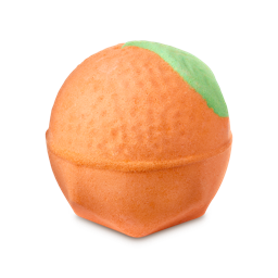 Merry Christmas Everyone. A spherical orange bath bomb, textured to resemble a real orange. A single splash of vibrant green colour covers a section of its upper right side, mimicking a leaf.