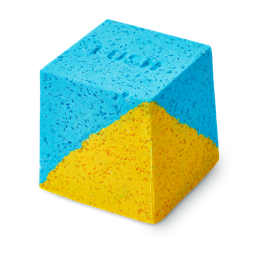 Salt Water Soother. A cube-shaped bath bomb with a split-colour design of bright blue and yellow. The top face features a debossed "LUSH" logo. The texture is coarse and granular with visible Epsom salt throughout.