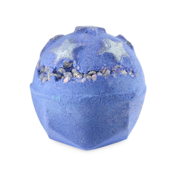 Silent Night bath bomb. The image shows a speckled, lilac-coloured bath bomb with a geometric base. It features large, shimmering silver stars on top and a band of iridescent, popping candy crystals around the middle.