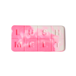 Snow Fairy. A rectangular pink and white marbled wax bar segmented into eight squares, embossed with the capital letters spelling "LUSH MELT"