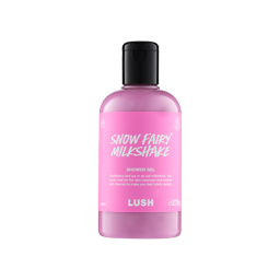 A clear bottle filled with opaque, creamy pink Lush Snow Fairy Milkshake shower gel, topped with a black cap and featuring a bright pink label