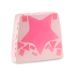 Snow Fairy. A trapezium-shaped, light pink soap slice. There is one large dark pink star through the middle with scattered patches. The word "SNOW" is embossed on the side of the soap and "FAIRY" is across the top. 