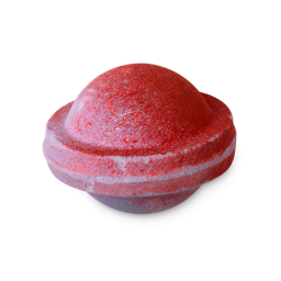 Space Girl. A fun, flying saucer-shaped bath bomb coloured in pastel purple and deep red with flecks of glitter throughout. 