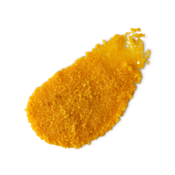 Sticky Dates. A neatly smeared swatch of thick, textured golden-yellow lip scrub with visible granulated sugar for exfoliation. 