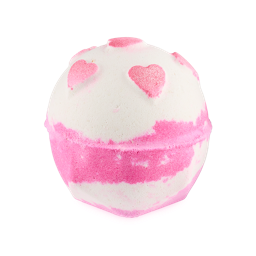 Sweetheart. A spherical bath bomb with a geometric base features a white top and a bright pink, marbled lower half. A ring of pink, shimmering hearts surrounds the top.
