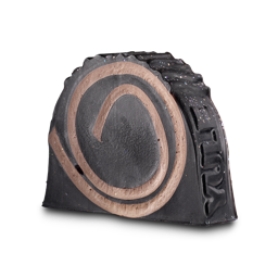 Yule Log soap. A dark chocolate-brown soap slice with a light brown swirl design, mimicking a cut log. It is an off-square shape with a rounded top. The top and side surfaces are textured and dotted with glitter.