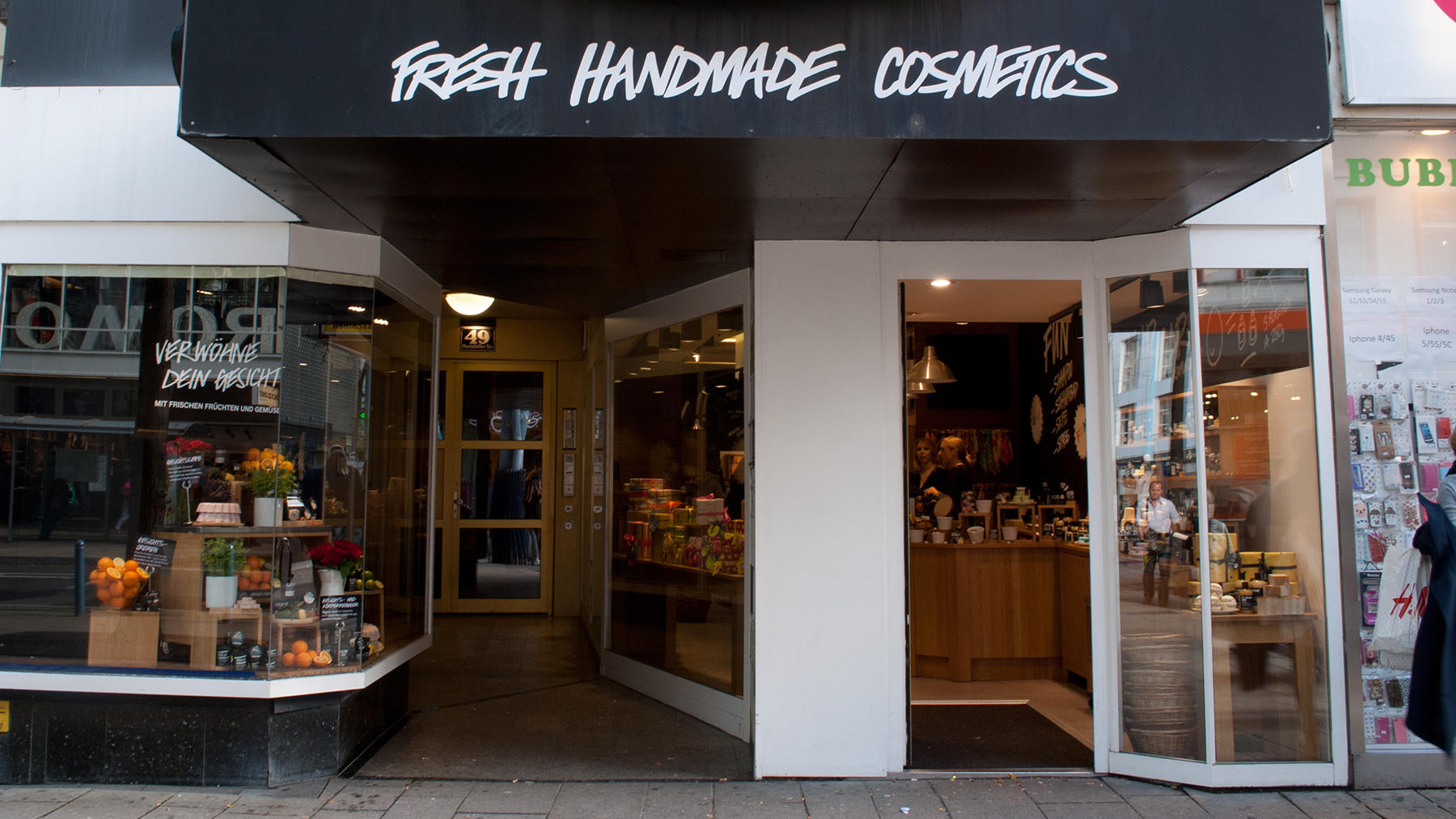 Shopfront of the shop, glass fronted shop with white pillars.