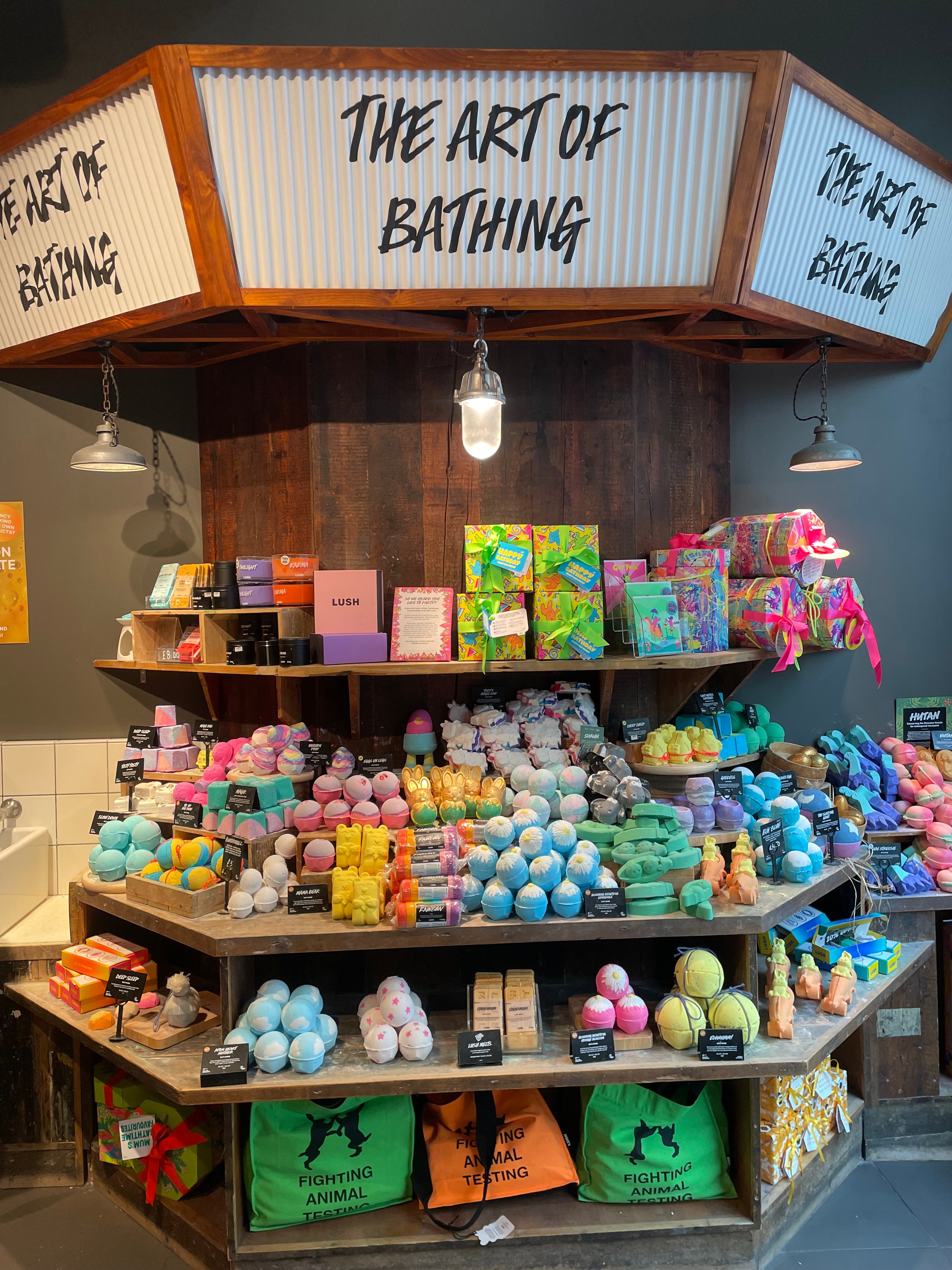 Image shows an abundant display of multicoloured bath bomb treats including the Easter and Spring range