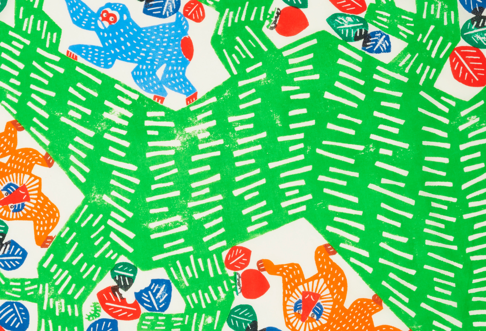 A close up of the Knot Wrap, focusing on the green tree and two monkeys, one blue, one orange.