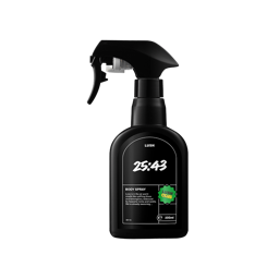 A black, curvy spray bottle of 25:43 Body Spray with a black trigger nozzle, centered on a black background. The label is black with white text detailing the product name and description, and it features a bright green "LUSH CLUB" sticker.