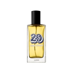 29 High Street. A rectangular glass perfume bottle containing a yellow liquid perfume, featuring a black cylindrical cap. The label shows a large, retro-style blue number '29' with 'HIGH STREET' and the 'LUSH' logo in white text.