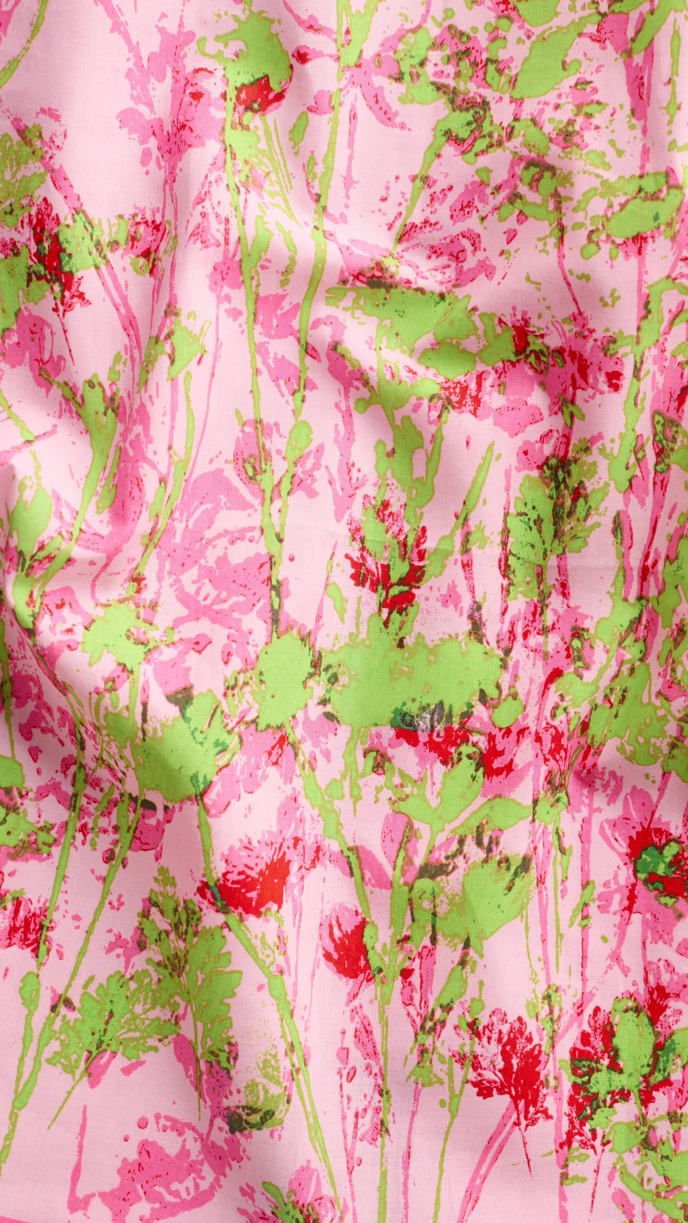 A super close-up texture shot of the "Floral Meadow" fabric knot wrap. The image focuses on the soft texture of the knot wrap material and the vibrancy of the colours in the bright, floral design.