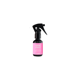 Snow Fairy. A black trigger-spray, 50ml bottle of Lush Snow Fairy body spray featuring a bright pink product label, standing upright