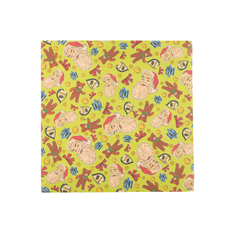 Santa's On His Way! A square sheet of Lokta wrapping paper. It features a yellow background with illustrations of bows, Santa faces, bells, rocking horse heads, and robot faces. 