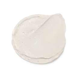 A close-up product swatch of a thick, rounded, creamy dollop of Feeling Younger Skin tint. The product is an iridescent, shimmery off-white/pale ivory highlighter