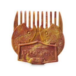 Gobber's Comb. A wide-toothed comb. The product is a deep marbled honey and auburn colour with intricate, Viking-style design of two identical dragon heads arching together from each side. The embossed text reads "DreamWorks How To Train Your Dragon"