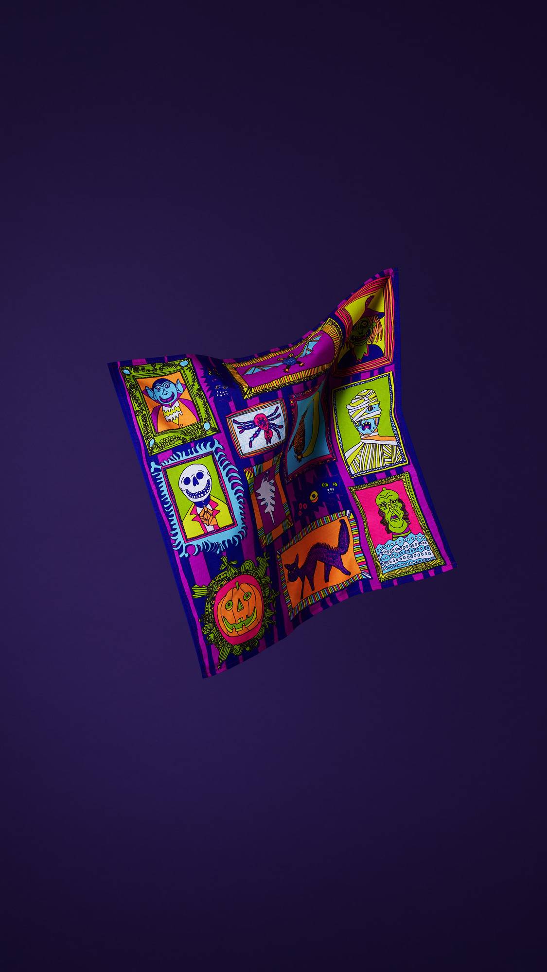 The image shows the square, multicoloured Fearsome Friends fabric knot wrap, suspended in mid-air against a deep purple background. It features a gallery of framed monster portraits in a variety of vibrant colours.