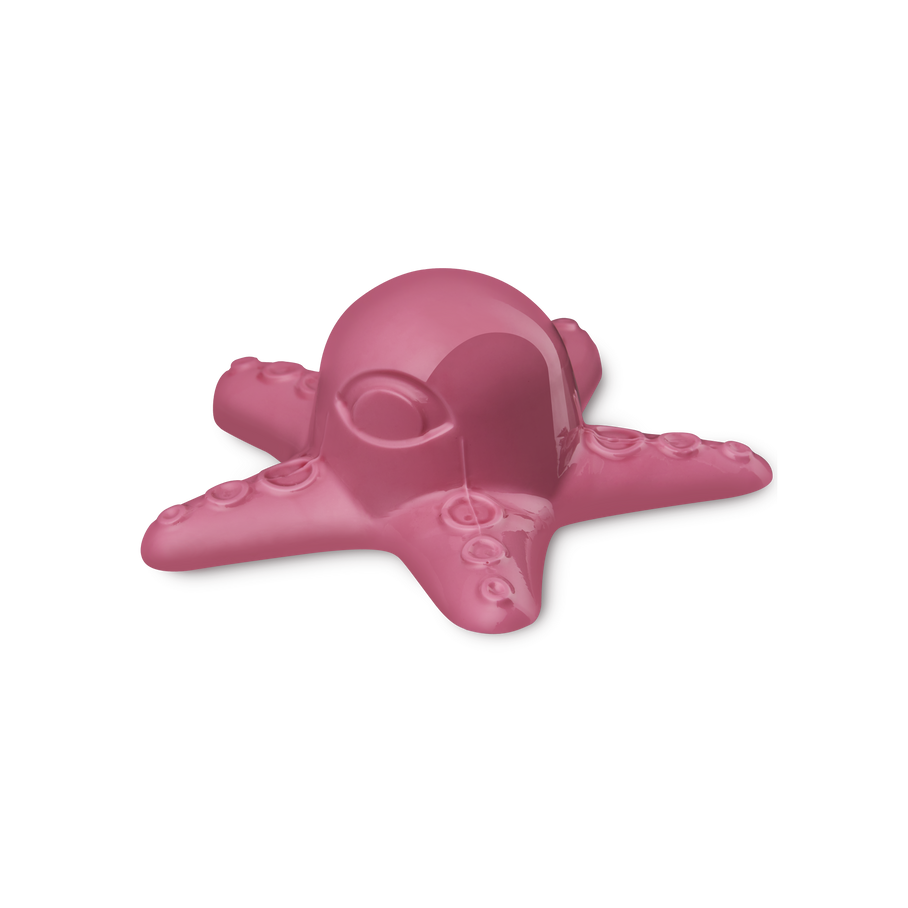 Octopus Prime. A large, vibrant, glossy pink shower jelly shaped like an octopus. It features a rounded head, five radiating tentacles with embossed suction cups, and one eye.