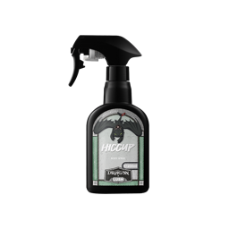 Hiccup. A classic LUSH, black, recycled plastic, flattened arch-shaped spray bottle. The front sticker resembles an illustrated stone arch window with a black dragon flying from the top. The text reads "Hiccup body spray" 