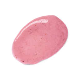 Jamil. A neatly-smudged swatch of pastel-pink, finely-textured body scrub flecked with fresh ingredient fragments. 