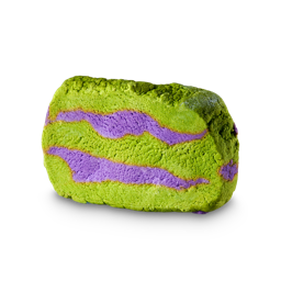Never Trust The Living. A thick-sliced slab of colourful bubble bar. It is an off-oblong shape and coloured a bright, lime-green with two stripes of purple running across.