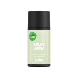 Milky Bath. A short, cylindrical black push-up tube of the "Milky Bath" solid perfume with an ivory label on the front, with the product name and scent printed on it. 