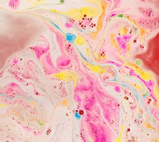 Snow Fairy Lights bath bomb has completely dissolved leaving behind a colourful, confetti of pink, blue and yellow swirls.