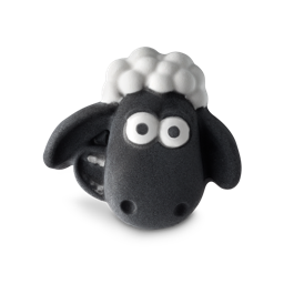 Shaun The Sheep. A novelty bath bomb shaped like the smiling shape of a sheep. It has a black face with an open mouth, floppy ears, big eyes and a white bundle of wool on the top of its head.
