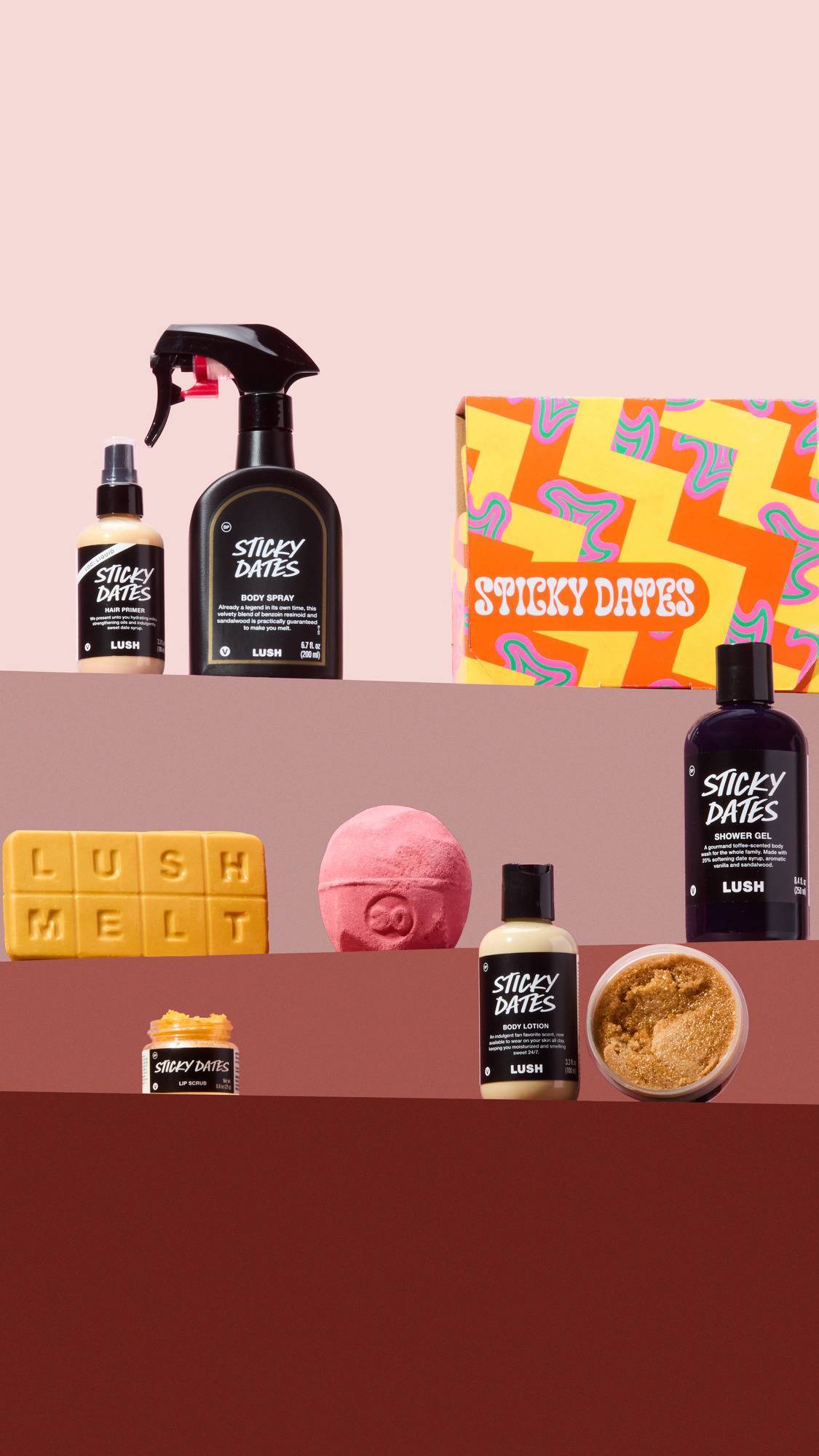 The Sticky Dates range is displayed on three coloured shelves. Products include hair primer, body spray, gift box, Lush Melt, bath bomb, shower gel, lip scrub, body lotion, and an open pot of body scrub.