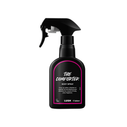 The Comforter body spray. A black spray bottle of Lush "The Comforter" Body Spray. The product label is black with a hot pink banded border. White text states the product name and the scent description.