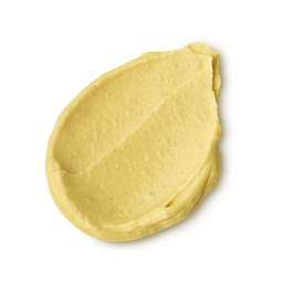 Ahaa. A thick, textured dollop of mustard-yellow scalp treatment. The product has a slightly grainy, matte consistency with visible ridges where it has been smoothed. 