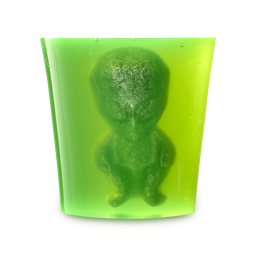 Alien Egg Farm. A translucent, vibrant lime green shower jelly. Embedded within is a solid, darker figure, shaped like a classic small alien with a large head and body, appearing suspended.