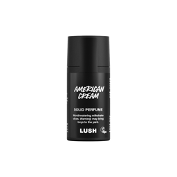 American Cream. A short, cylindrical black push-up tube of the American Cream solid perfume with a black label on the front covering the cap, with the product name and scent printed on it. 