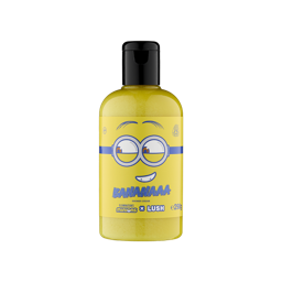 A bottle filled with bright yellow Lush shower cream, featuring a yellow label styled like a Minion face with goggles and the text "Bananaaa".