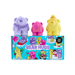 A Lush Bear Hugs gift box featuring colourful cartoon bears on a blue background, topped with three bear-shaped bath products in purple, pink, and yellow,