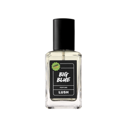 A clear glass square bottle of Big Blue Perfume with a black spray top, centered on a light grey background. The label is black with white, handwritten-style text and a small green "LUSH CLUB" sticker in the top left corner.