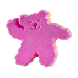 Birthday Bear. This bath bomb is shaped like a fuzzy teddy bear complete with a smiling face, posed as if it is waving. The bath bomb has a bright yellow middle layer, sandwiched between two vibrant pink layers. 