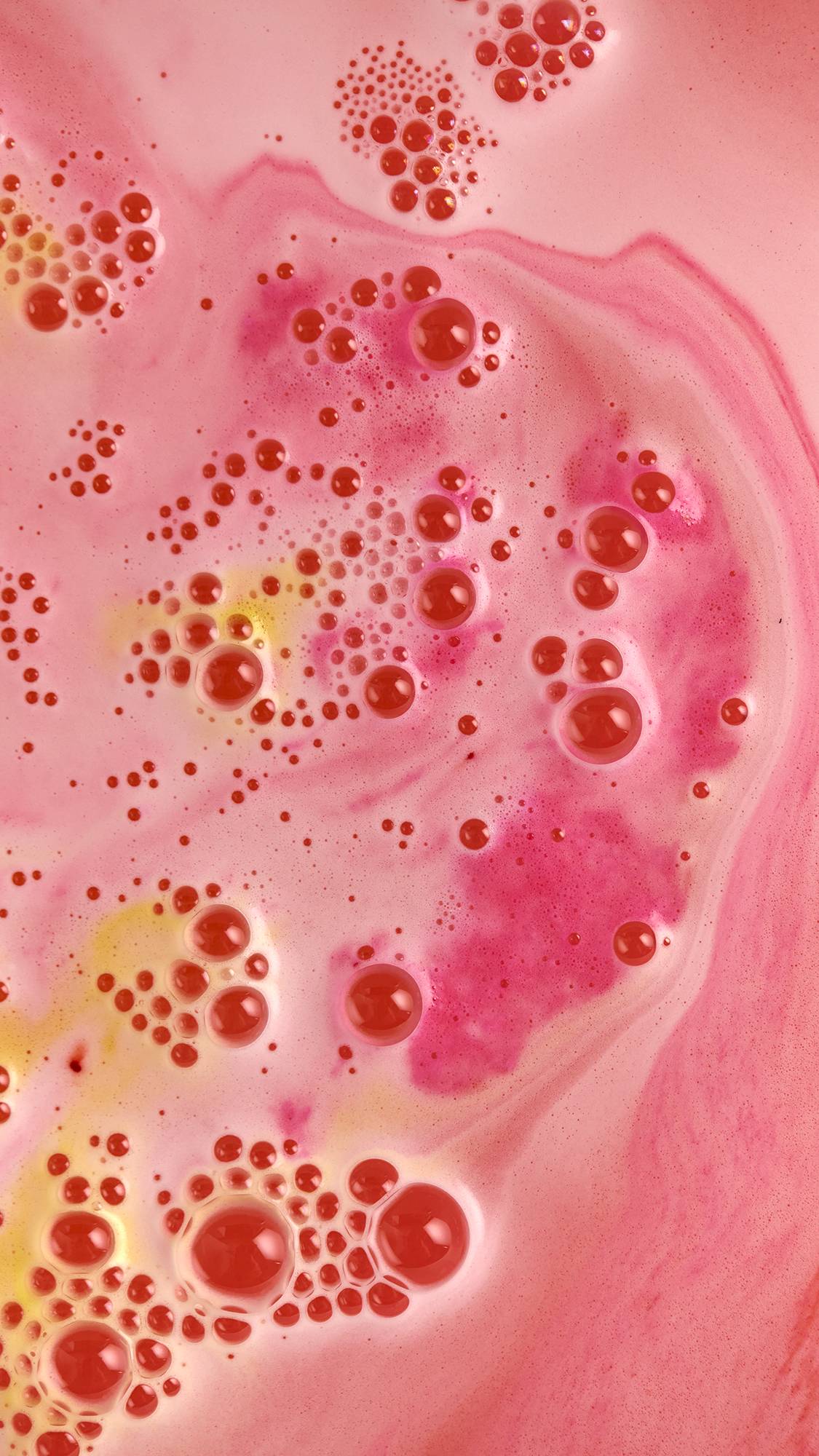 The Blooming Beautiful Orange Blossom bath bomb is dissolving leaving delicate coral waters with hints of orange.