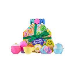 Blooming Marvellous gift. A hexagonal floral box with a green ribbon and eight included bath bomb and bubble bar products placed on and around the box.