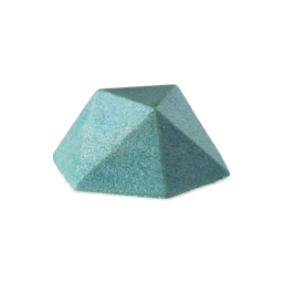 A faceted, pyramid-shaped bar of Blue glitterbug body bar in a dense, shimmering teal-blue color with visible plastic free glitter, set against a light grey background.