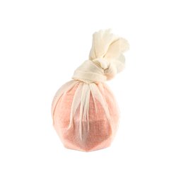 Bonfire. A round, peach-orange bath product tied inside a light cream muslin fabric wrap, gathered into a knot at the top.
