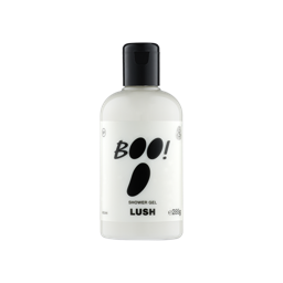 A clear bottle filled with opaque white Lush Boo! shower gel, topped with a black cap and featuring a white label with bold black text that resembles a ghost's face