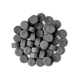A pile of small, circular, black Boom! toothpaste tabs shot from above.