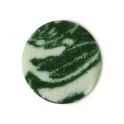 Botanomancy. A perfectly circular swatch of marbled deep, forest-green and white textured sugar-based body scrub.