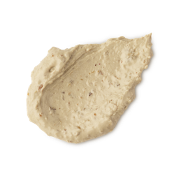 Bring Us Some Figgy Pudding. A neatly smudged swatch of thick, creamy, textured face mask. There are flecks of finely ground dried figs throughout the product. 